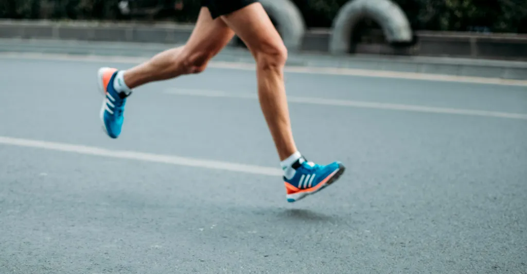 Man running on road.