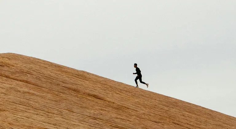Runner on hill.
